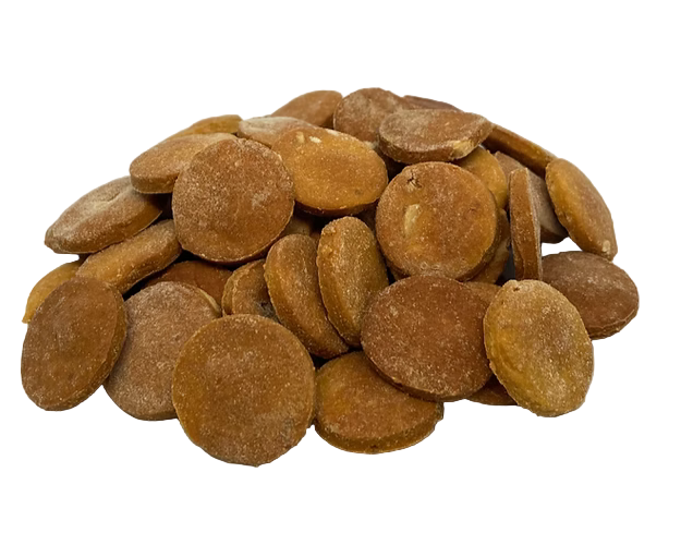 Brown round dog treats on a white background
