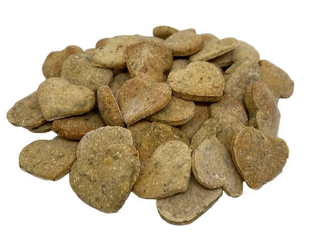 Stack of heart-shaped pet treats on a white background