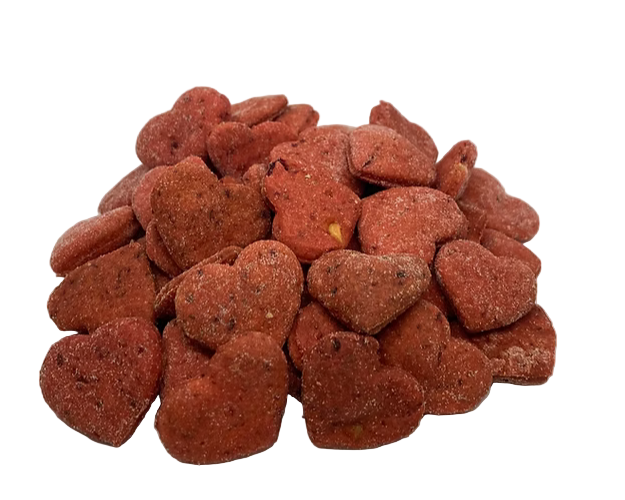 Heart-shaped red dog treats on a white background