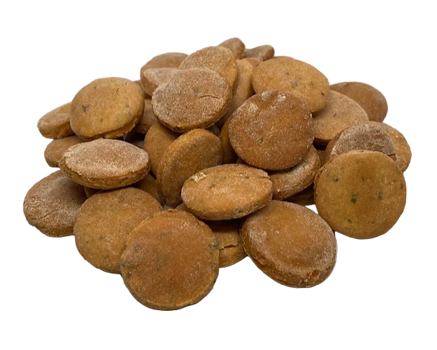 Stack of brown dog treats on a white background