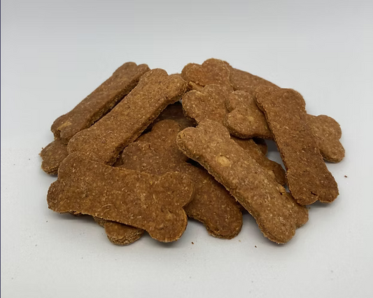 Dog treats shaped like bones on a white background