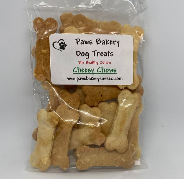 Packaged dog treats with 'Paws Bakery' label on a white background