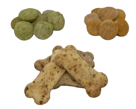 Dog treats in various shapes and colors on a white background